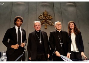 Catholic students Elvis Do Ceu and Federica Ceci with Cardinal Lorenzo Baldisseri and Bishop Fabio Fabene in at Vatican press office for the release of the preparatory document of the 2018 Synod of Bishop on young people (AP)